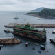 A photo of the Jumbo Kingdom floating restaurant being towed out to sea.